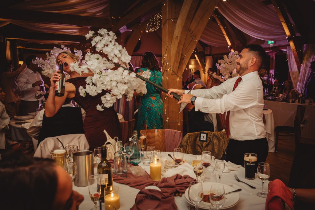 Guests enjoying a fun moment at a wedding.