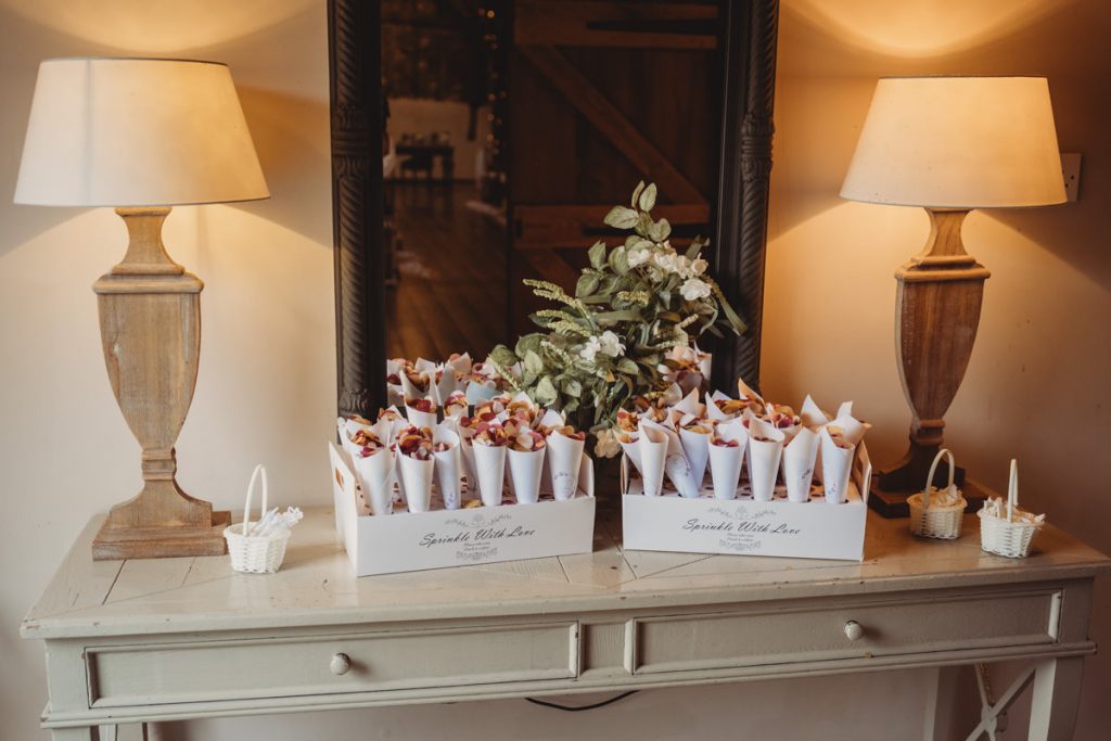 Petal cones and lamps on a wooden table.