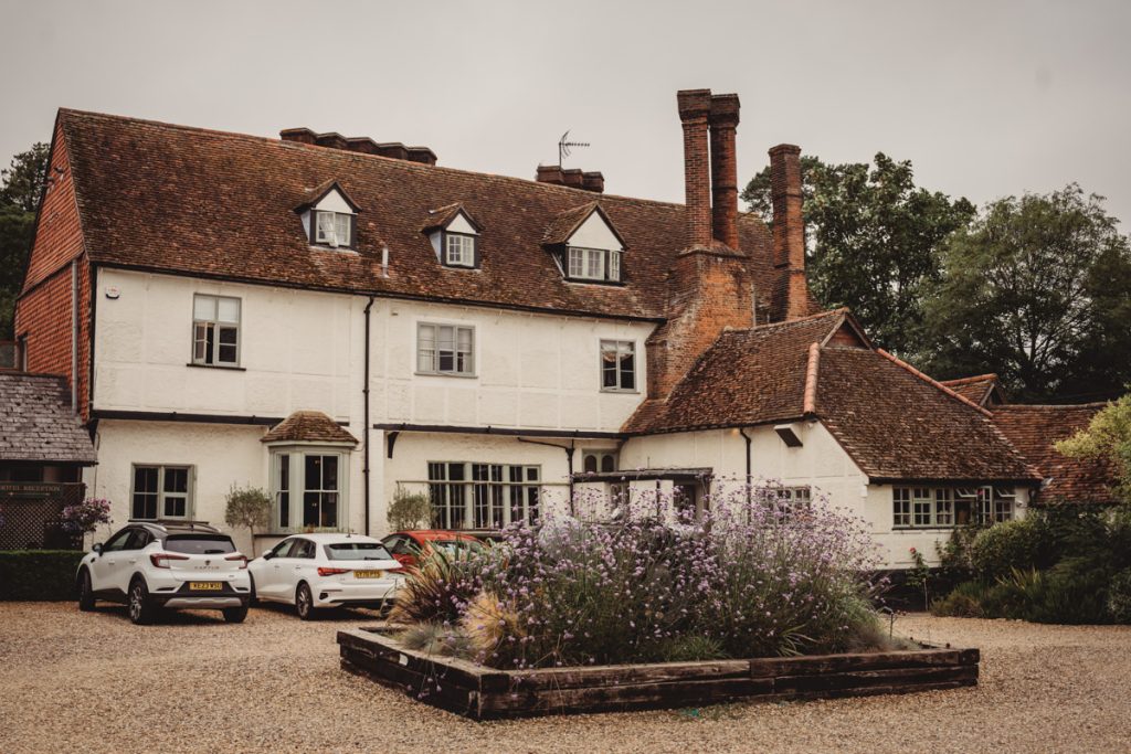 Rustic country house with parked cars