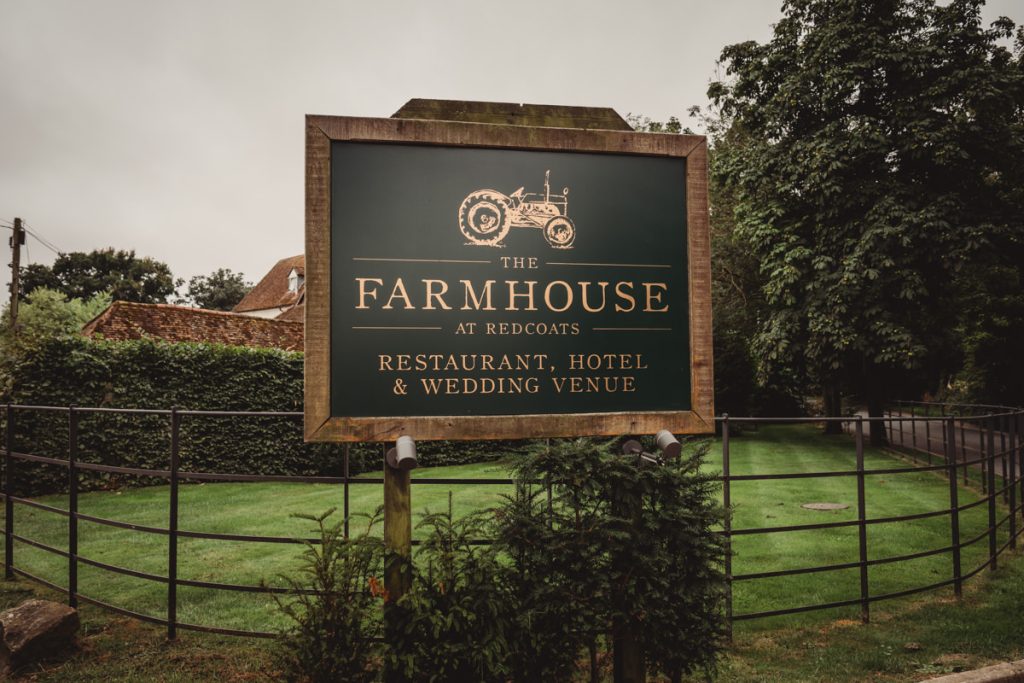 Farmhouse sign: restaurant, hotel, wedding venue at Redcoats.