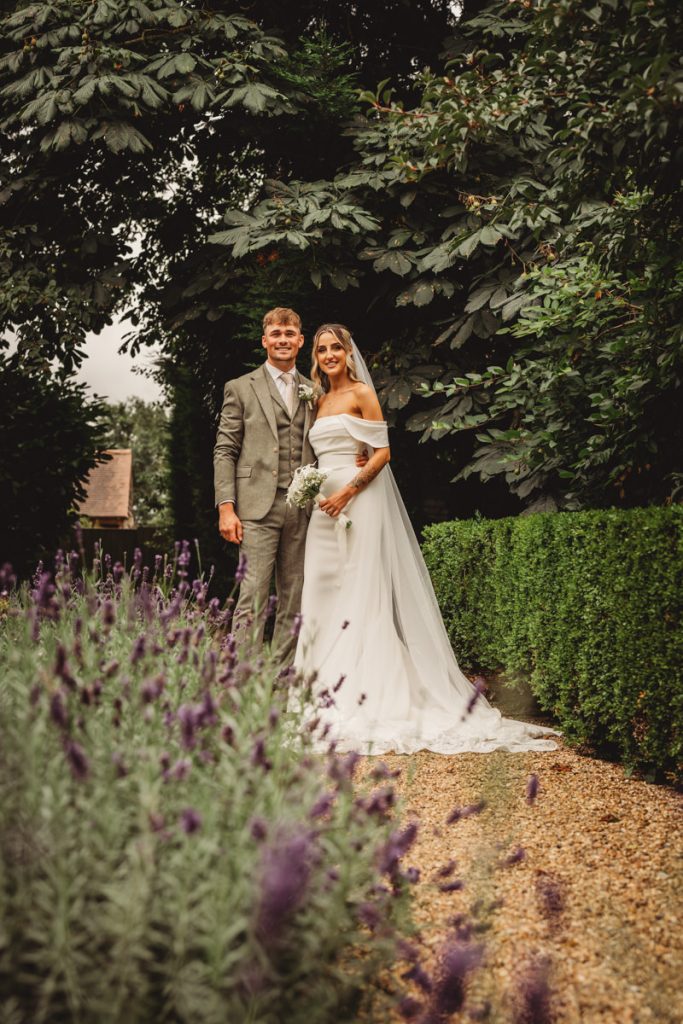 Bride and groom in garden, wedding photo