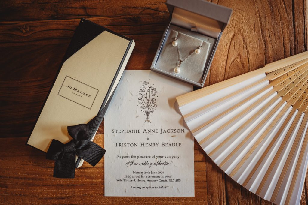 Wedding invitation with gift box, jewellery, and fan