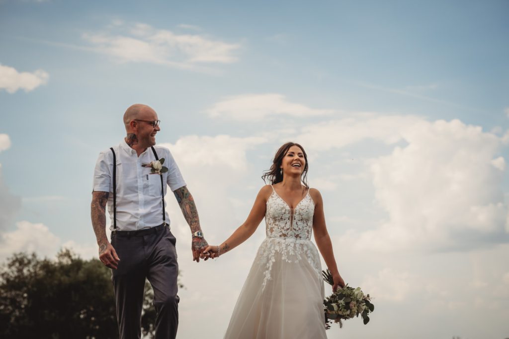 Happy couple walking on wedding day