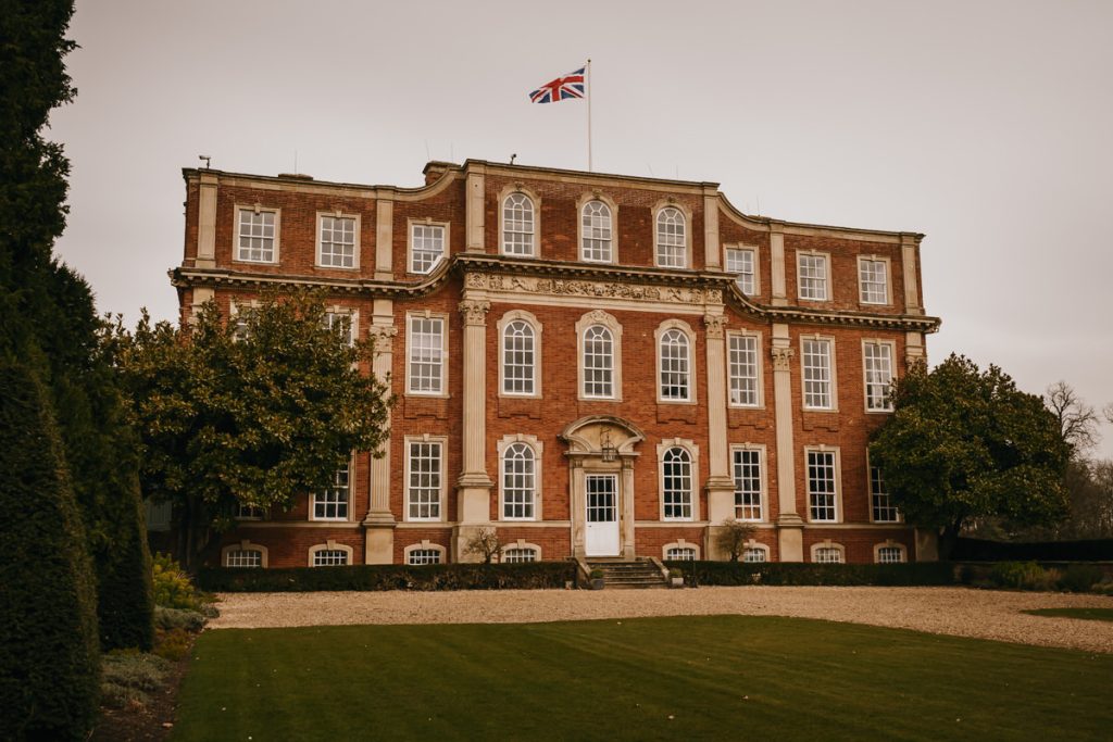 Historic British mansion with Union Jack flag