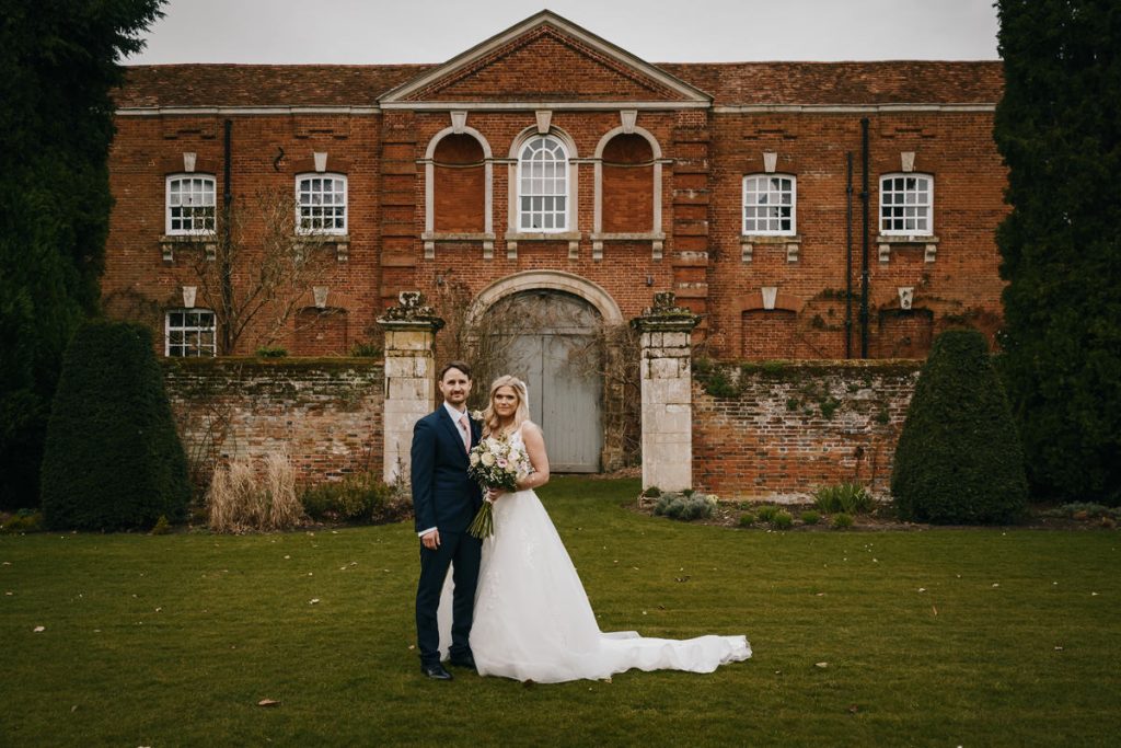 Bride and groom at historic brick building