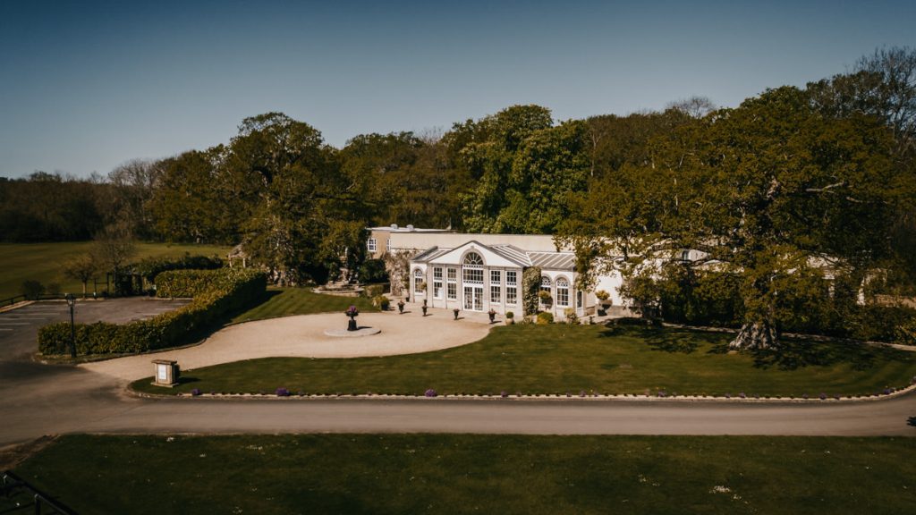 Elegant country house surrounded by lush greenery at Whittlebury Park