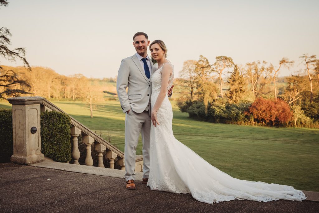 Bride and groom standing in a scenic garden at Kilworth House Hotel