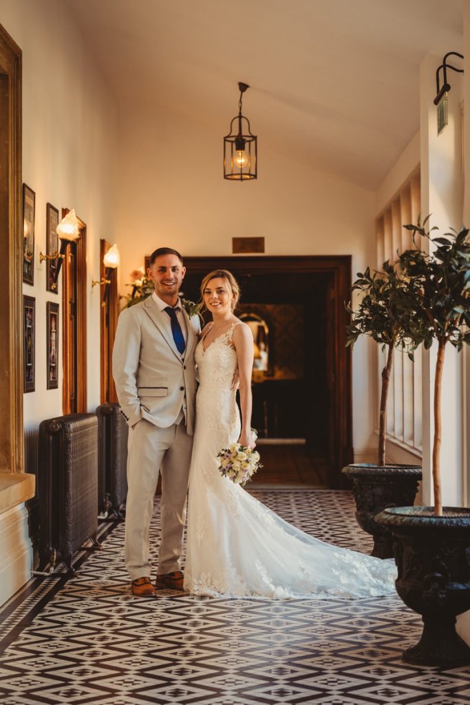 Bride and groom in elegant hallway at Kilworth House Hotel